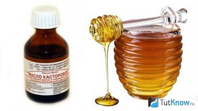 Баночка с касторовым маслом и емкость с мёдом