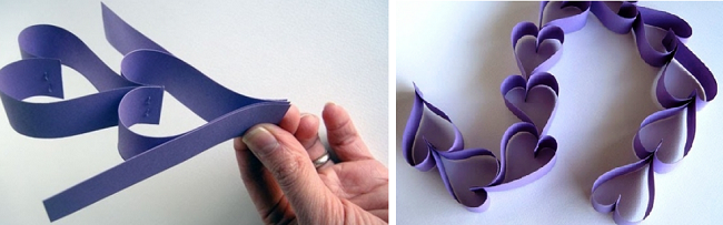 гирлянда из фиолетовых бумажных сердечек