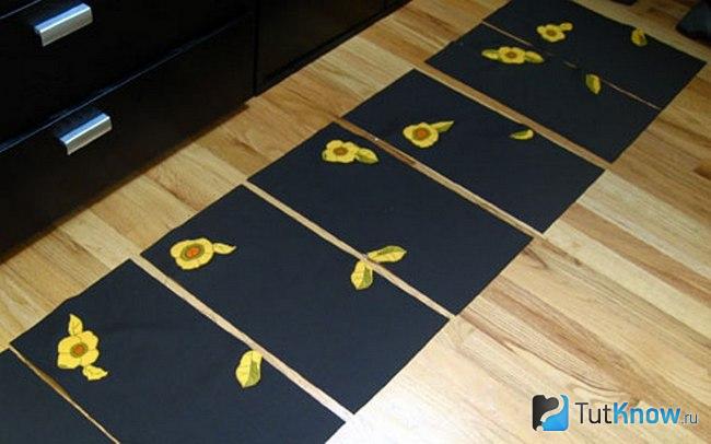 Жёлтый цветок выложен на ткань